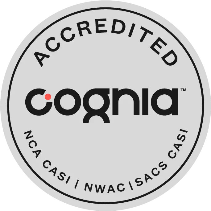 Circular Cognia accreditation seal with 'ACCREDITED' around the rim and the logo in the center.
